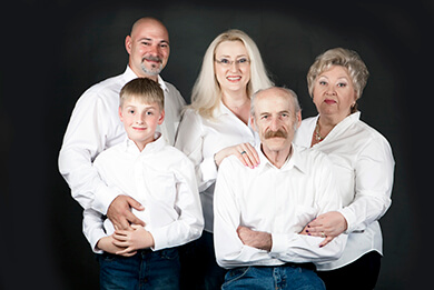 studio family photo shoot white on black